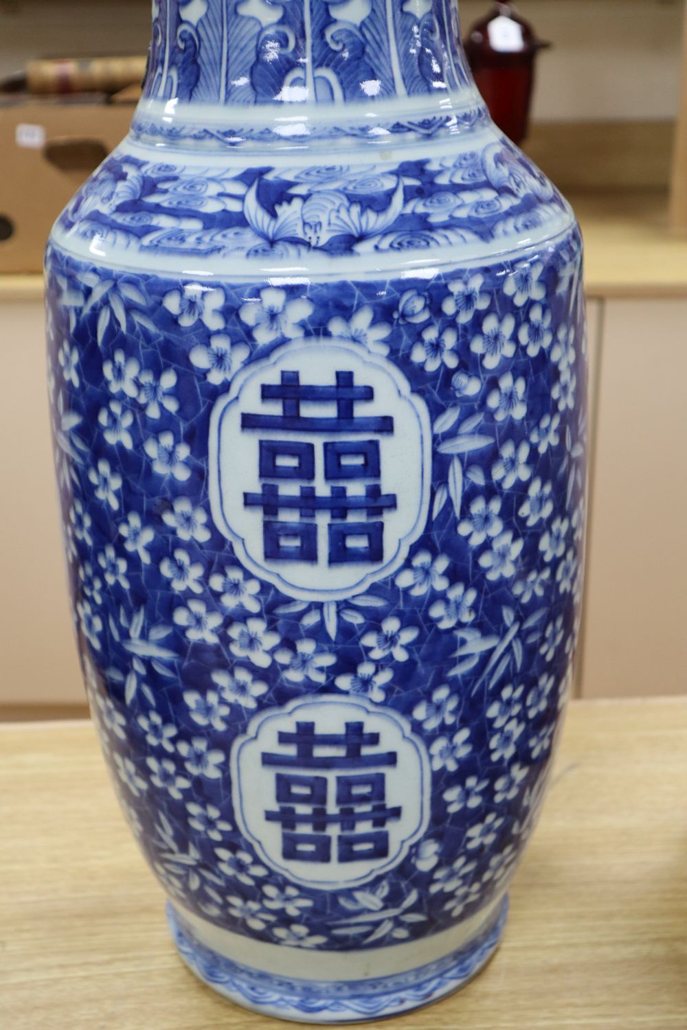 A large Chinese blue and white baluster vase, decorated blossom and characters (a.f.)